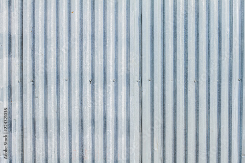 Metal building fence. Galvanized, corrugated texture