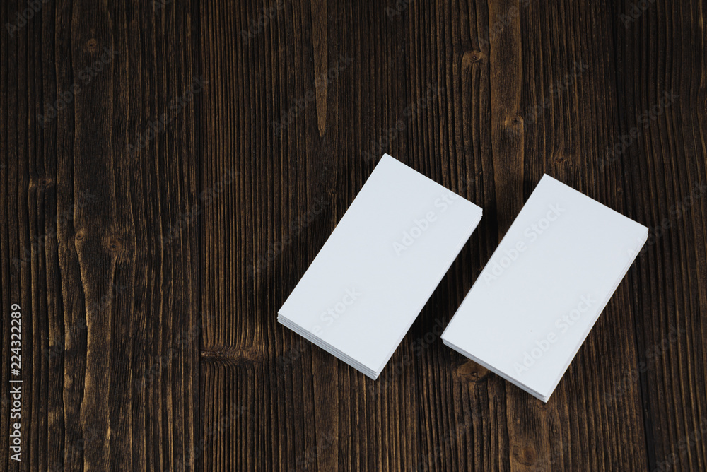 Blank business cards on wooden working table with copy space for add text ID. and logo, business company concept. Blank business cards on wooden working table with copy space for add text ID. and logo, business company concept.