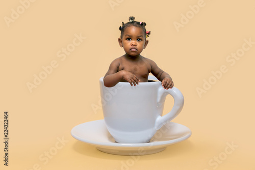 Baby in a coffee cup