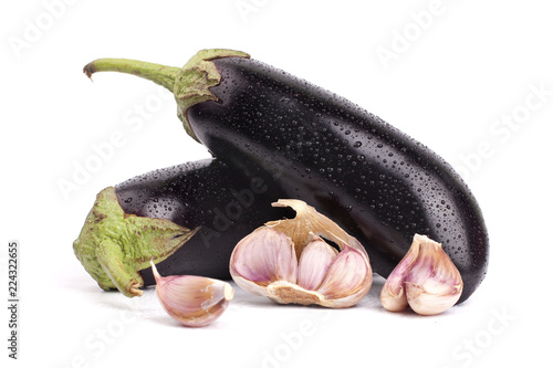 Garlic cloves and eggplant  in water drops on a white background isolated close up photo