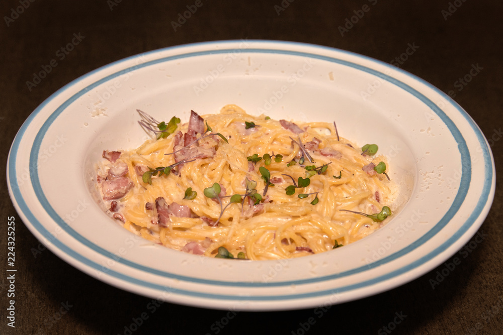 Pasta with white sauce and bacon