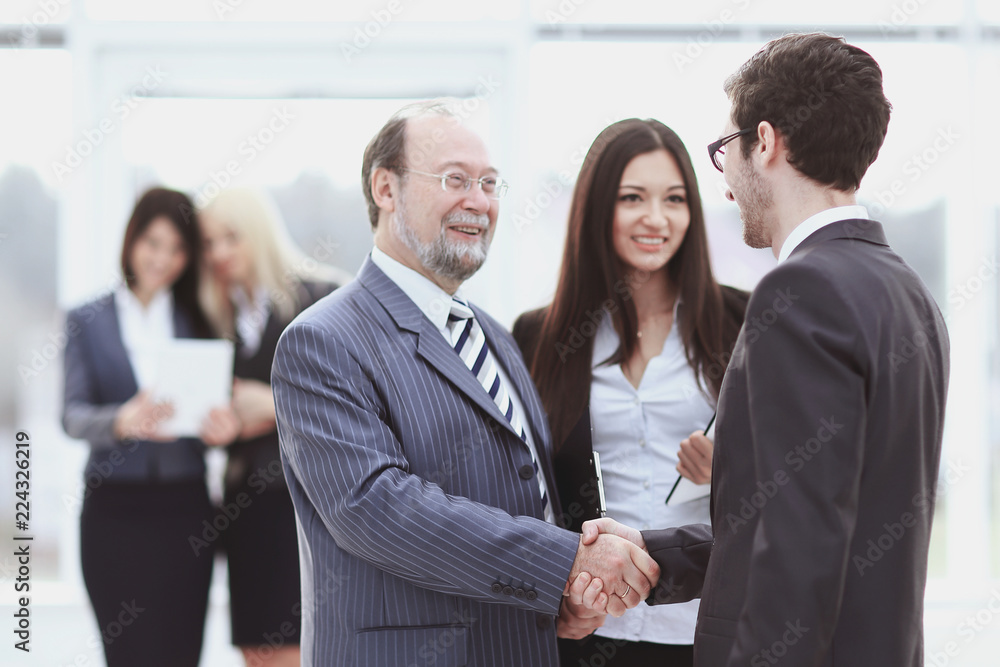 welcome and handshake of business people in the office. welcome and handshake of business people in the office.