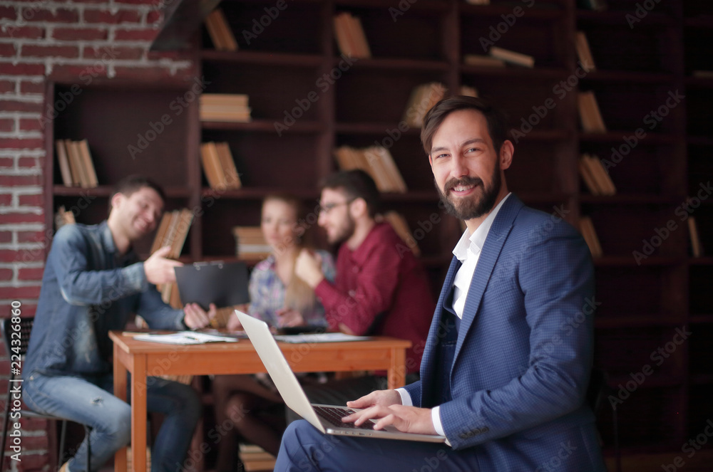 close up.smiling Manager works on laptop. business concept close up.smiling Manager works on laptop. business concept