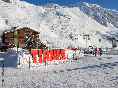 French ski resort station of Tignes in winter, letters Tignes with snow, The Alps, France photo