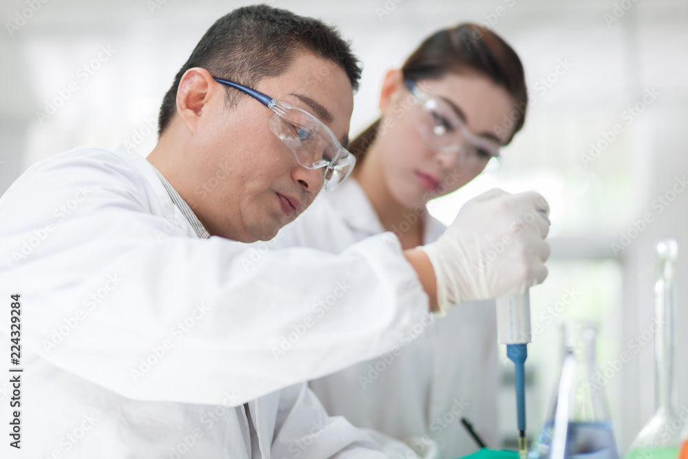 people working at laboratory people working at laboratory