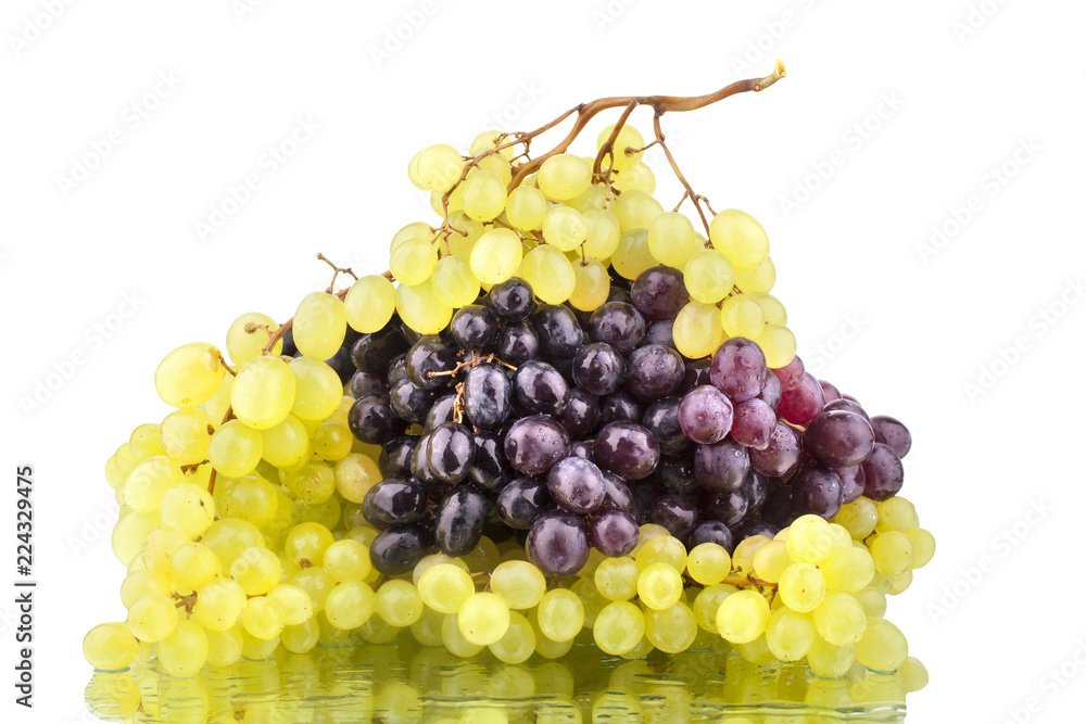 Black and white grapes on a white mirror background isolated close up