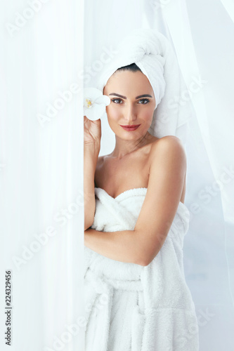 Body Skin Care. Beautiful Woman In Towel In Beauty Spa Salon