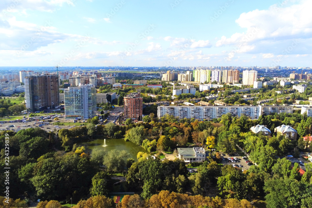 Fototapeta premium Aerial view of Kiev park and old famous exhibition complex VDNH. Metropolis Ukraine capital panoramic scenic autumn drone photo