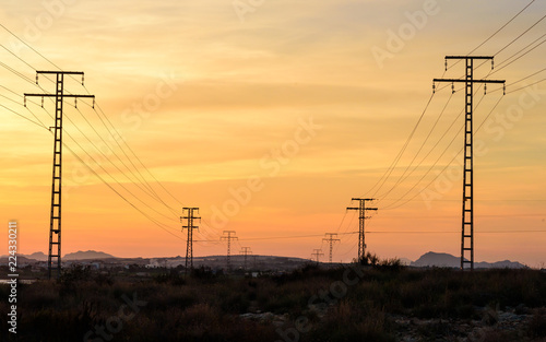 High voltage power lines at sunset