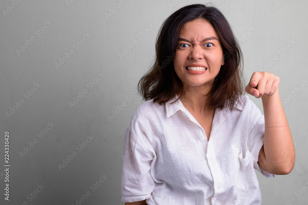 Portrait of young beautiful Asian woman with short hair Portrait of young beautiful Asian woman with short hair
