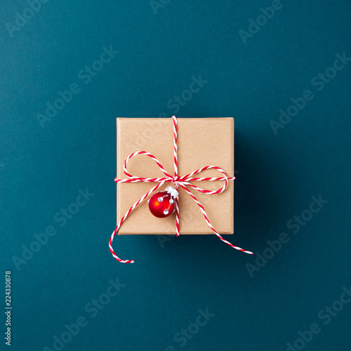 Gift boxe wrapped in kraft paper tied with candy cane Christmas rope on dark ...