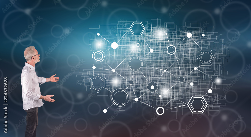 A virtual network explained by a businessman on a wall screen A virtual network explained by a businessman on a wall screen