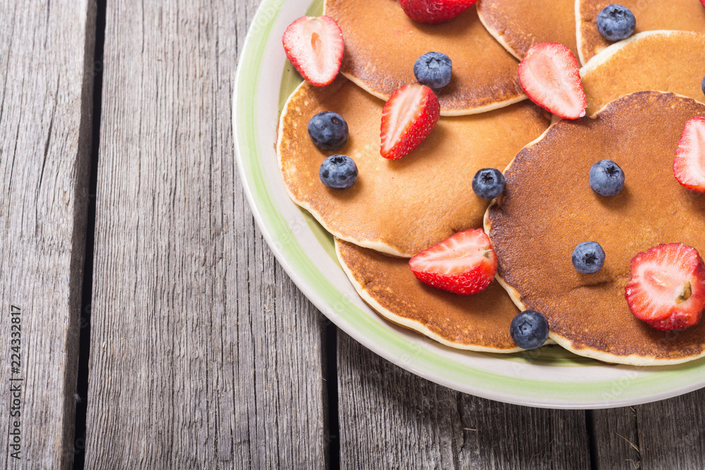 Pancakes with strawberry and blueberry