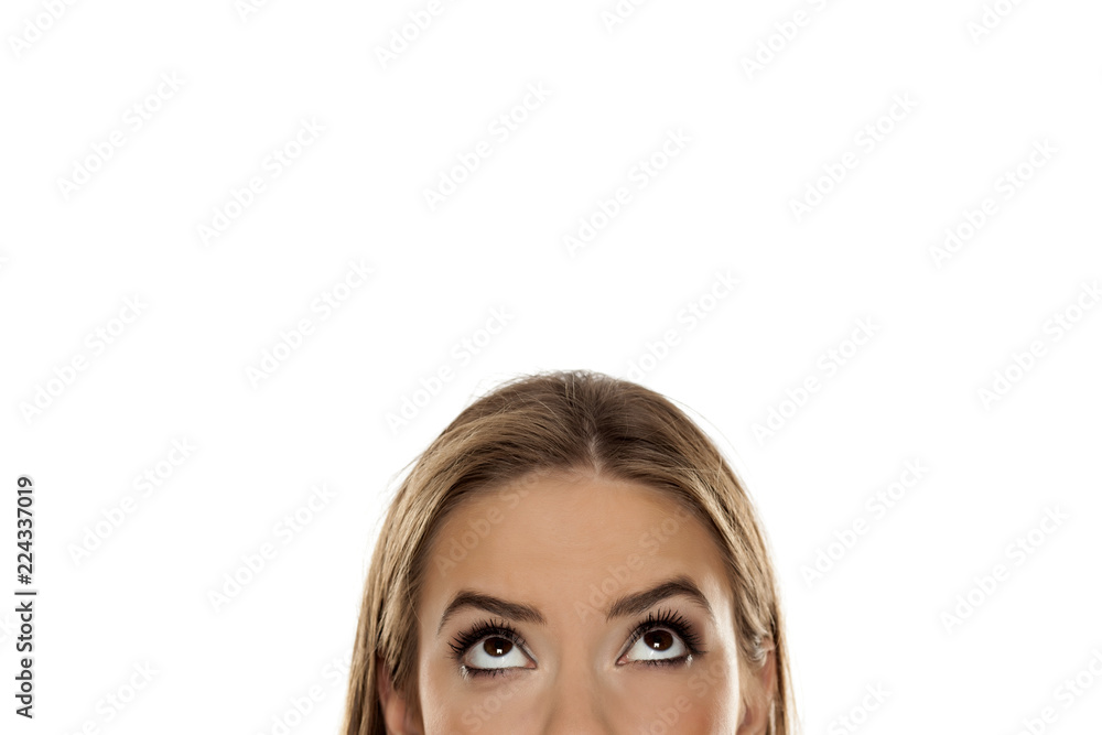 half portrait of a young girl looking up on white background half portrait of a young girl looking up on white background