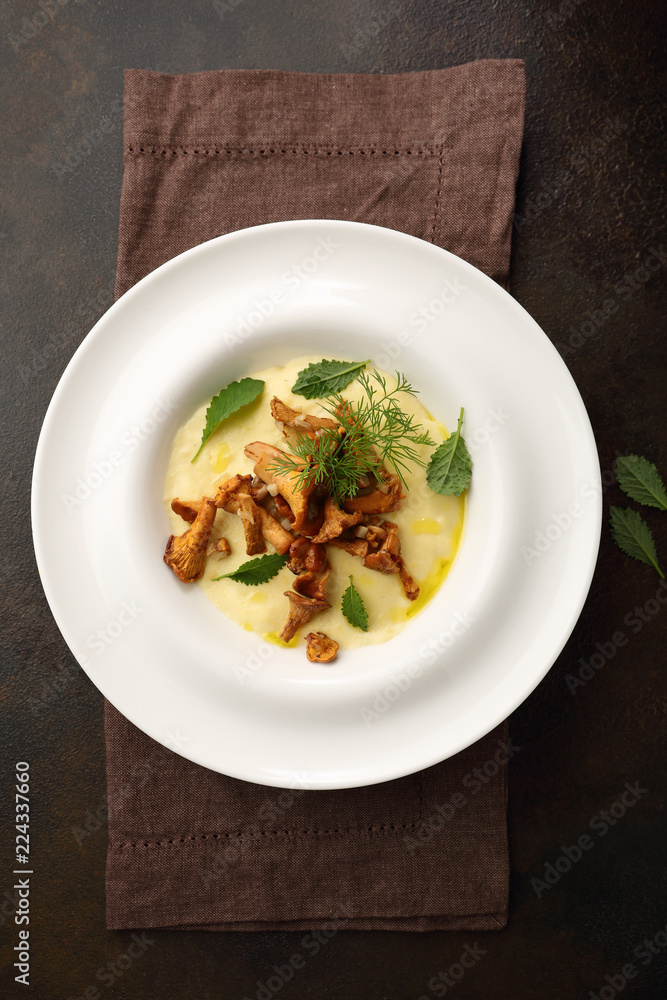 Polenta with roasted mushrooms sauce top view Polenta with roasted mushrooms sauce top view