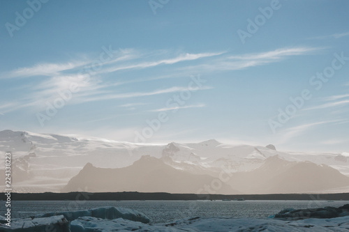 tranquil shot of beautiful mountains covered with sunset mist in Jokulsarlon, Iceland