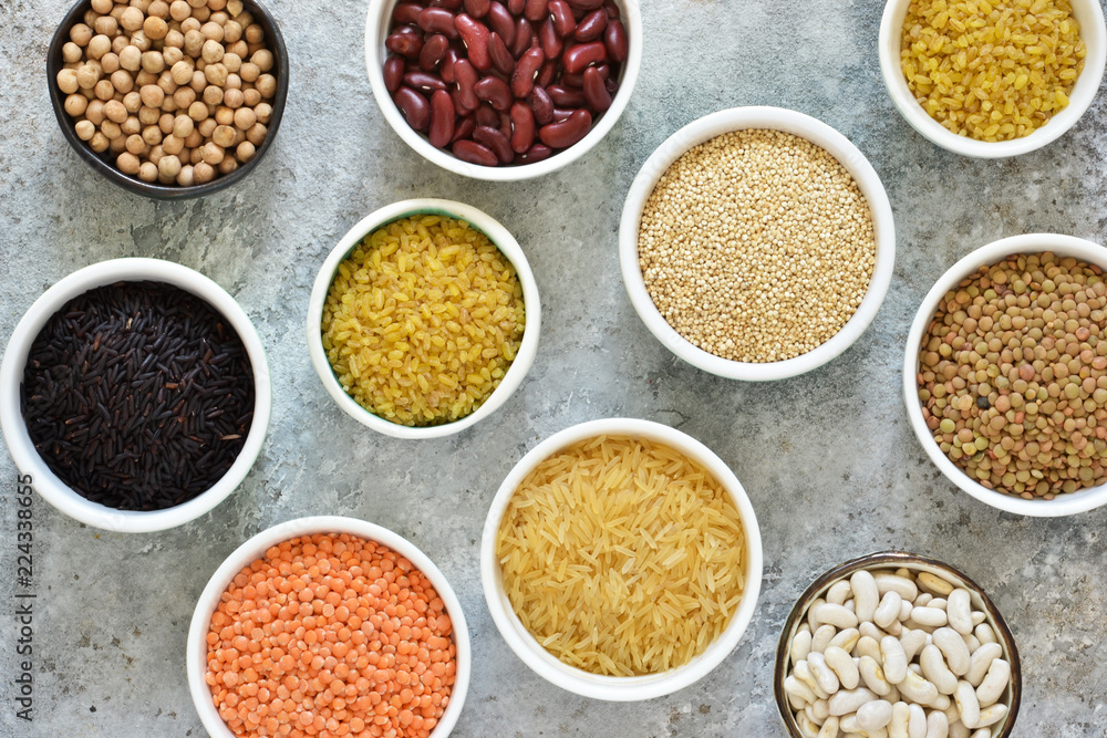Variation of cereals in bowls: beans, rice, chickpeas, peas on a concrete background. Variation of cereals in bowls: beans, rice, chickpeas, peas on a concrete background.