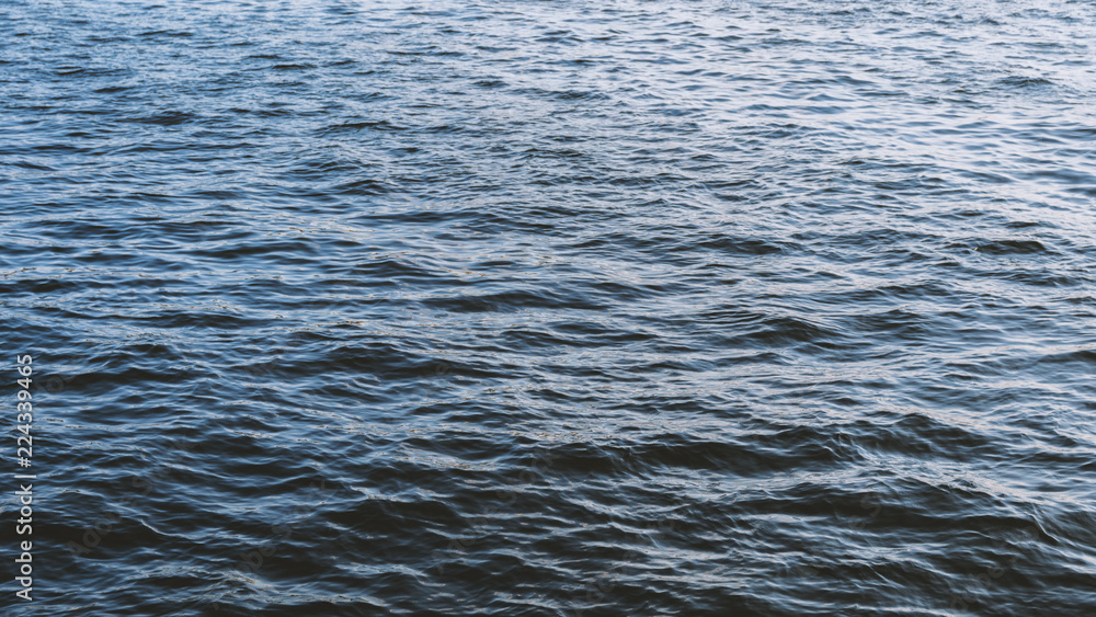Sea surface as natural background, color toned. Sea surface as natural background, color toned.