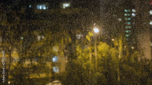 Raindrops on the window glass. The view from the window