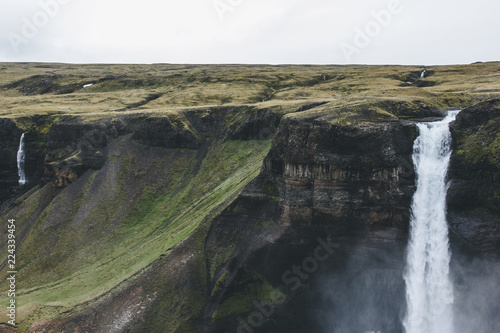 Aerial view of dramatic Haifoss waterfall and rocky cliff  Iceland