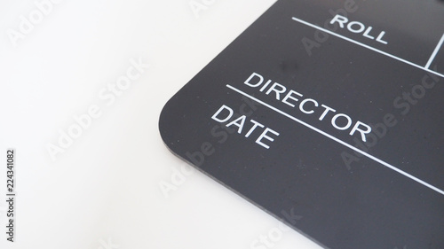 Black Clapperboard or clap board or movie slate use in video production , movie, cinema industry on white background .