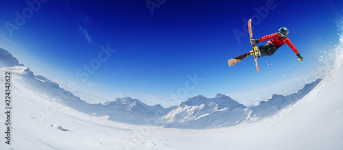 Fototapeta Naklejka Na Ścianę i Meble -  Skiing. Jumping skier. Extreme winter sports.