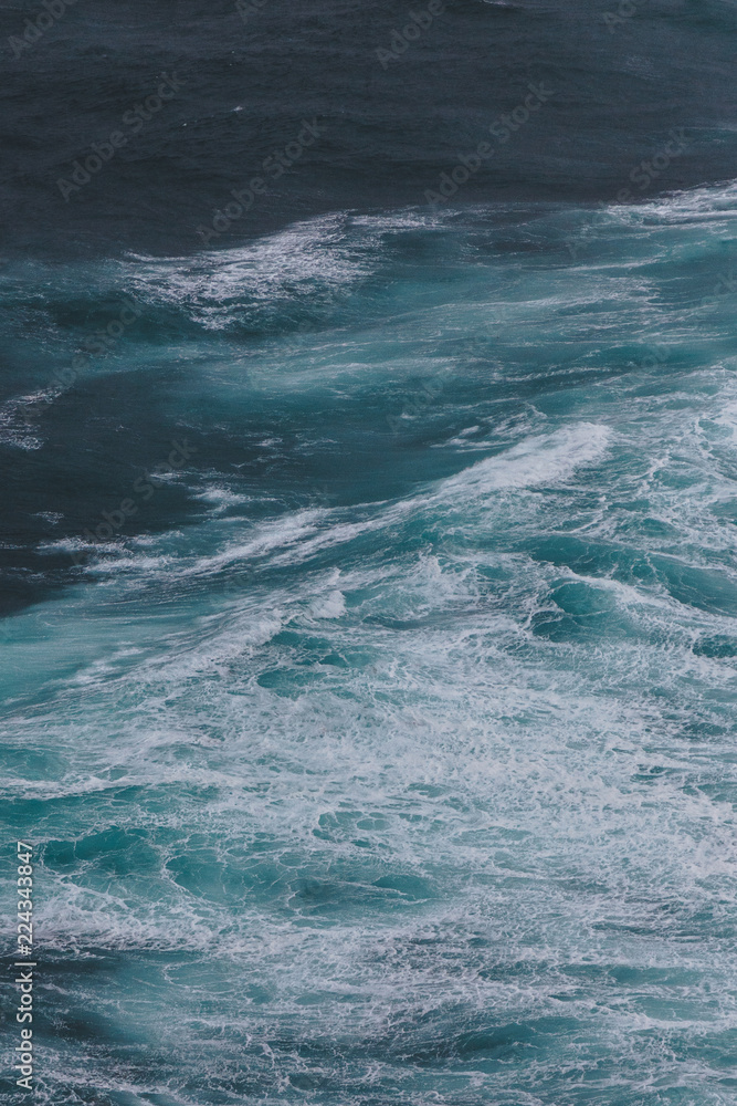 dramatic shot of ocean with foamy waves for background