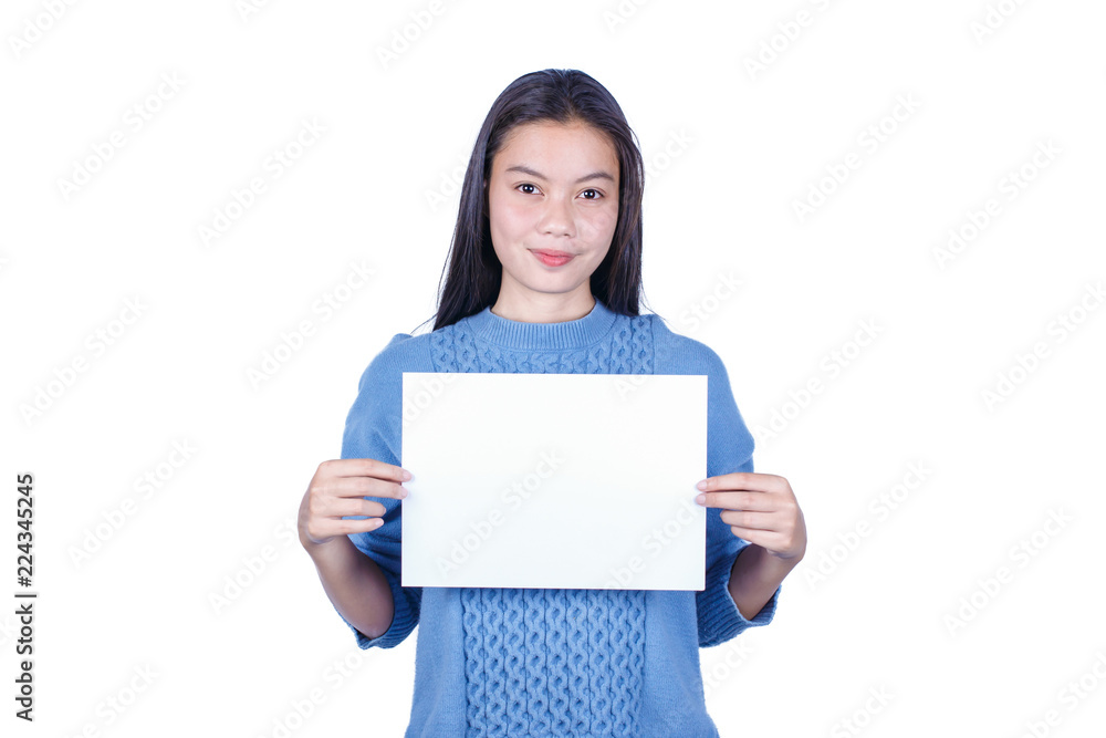 Young beautiful girl in blue sweater holding empty white paper and space for text on white background Young beautiful girl in blue sweater holding empty white paper and space for text on white background