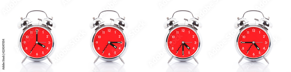 GROUP OF RED CLOCKS ON WHITE BACKGROUND. GROUP OF RED CLOCKS ON WHITE BACKGROUND.