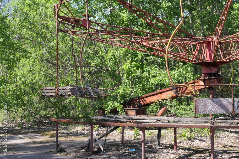 Abandoned carousel in the amusement park near the ghost town of Pripyat, Chernobyl exclusion zone, Ukraine Abandoned carousel in the amusement park near the ghost town of Pripyat, Chernobyl exclusion zone, Ukraine