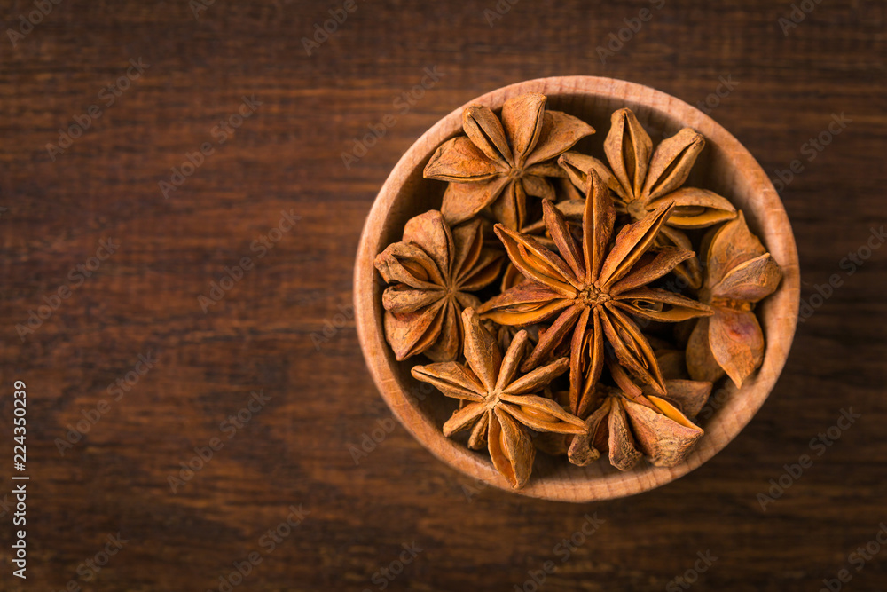 Anise star, close-up, fragrant spice, wooden background