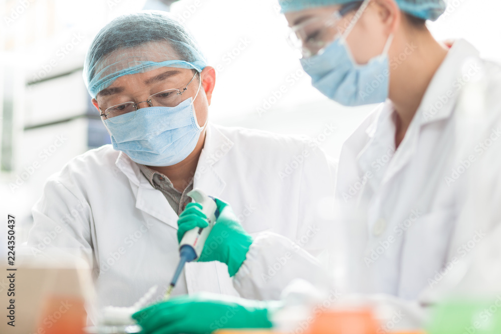 people working at laboratory people working at laboratory