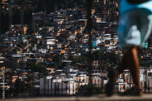 Man looking over the favela of Complexo do alemão in Rio de Janeiro photo