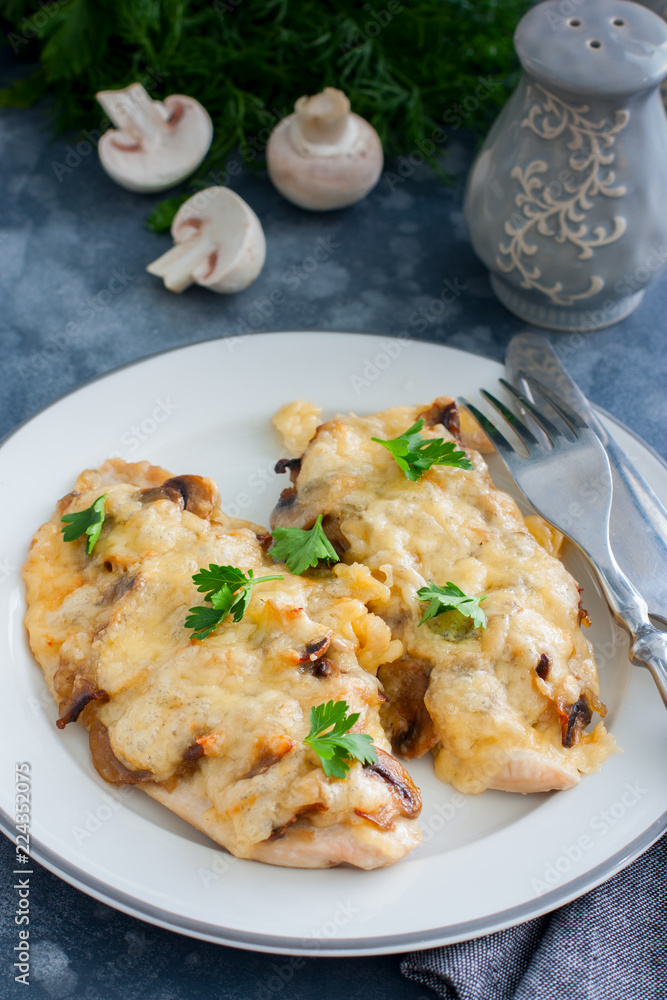Chicken fillet breast with cheese and mushrooms, selective focus Chicken fillet breast with cheese and mushrooms, selective focus