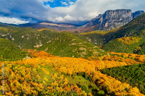 Aerial view of the the Vikos Gorge in the autumn and provincial road with many zigzag in the Epirus Zagorohoria, Greece. National park
