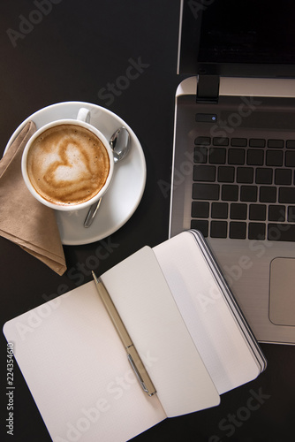 Working at a cafe with latte art cappuccino.  Business meeting. Top view shot.