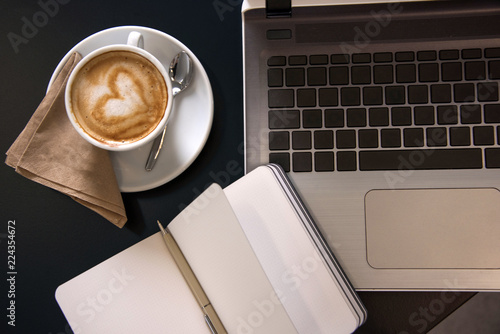 Working at a cafe with latte art cappuccino.  Business meeting. Top view shot.