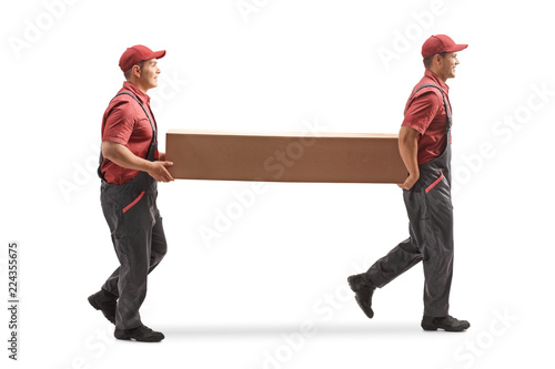 Two movers carrying a big cardboard box photo