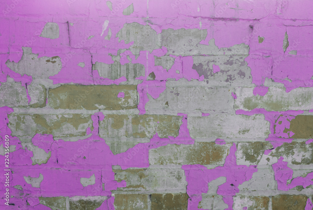 Fototapeta premium Brick wall with peeling paint