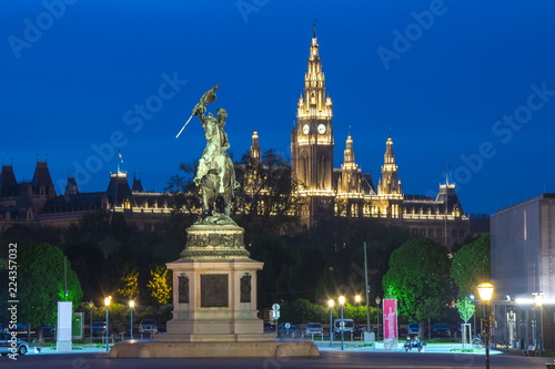 Statue of Archduke Charles and Vienna City hall at night, Austria