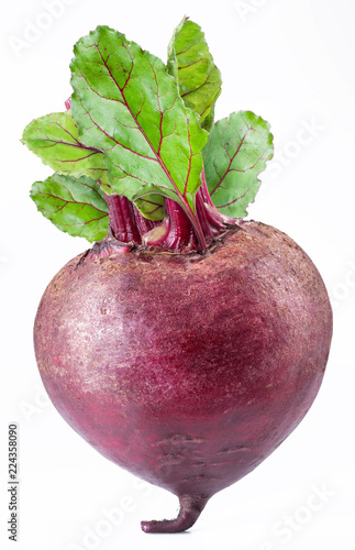 Red beet or beetroot with green leaves on white background.