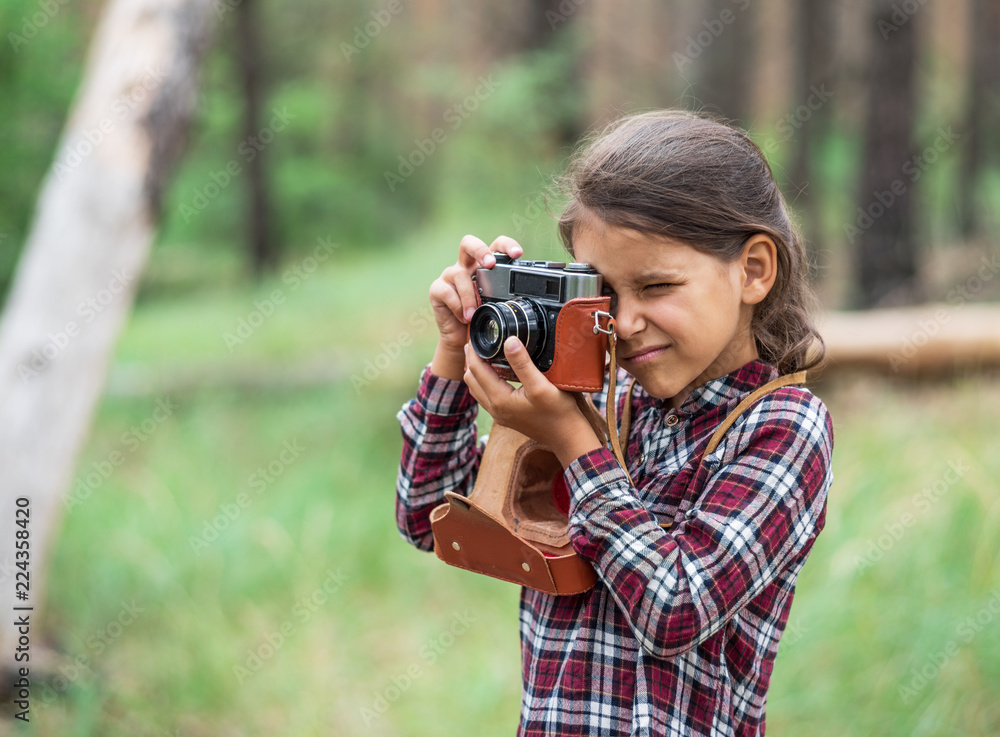 Young photographer. Small girl with camera. Young photographer. Small girl with camera.