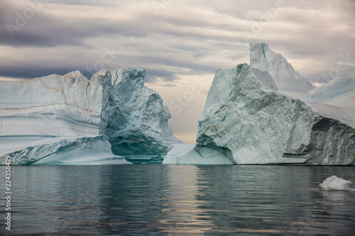 massive Icebergs floating in the fjord scoresby sund, east Greenland  photo