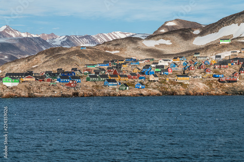 settlement of Ittoqqortoormiit with colorful houses, eastern Greenland at the entrance to the Scoresby Sound fjords