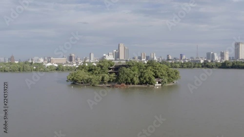 Aerial footage of a river and a temple in an island at Jiaxing City in Zhejian, China photo