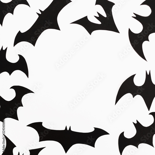 Frame of Halloween paper black bats on white background. Flat lay  top view.