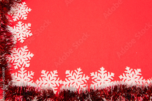 Christmas background. Christmas decoration. Snowflakes on red background.