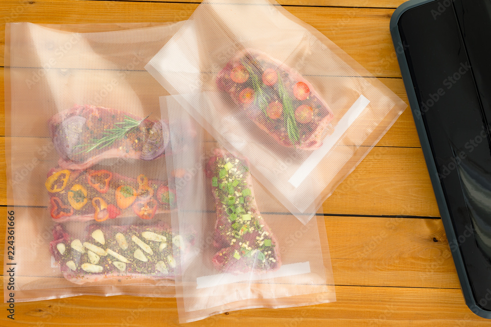 Three vacuum packed bags of flat iron steaks Three vacuum packed bags of flat iron steaks