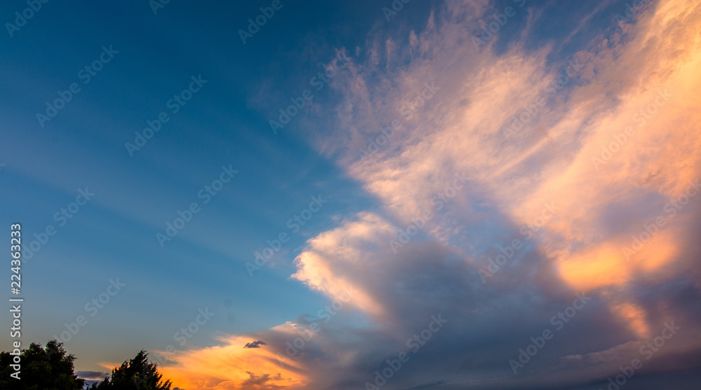 Naklejka premium Light rays through clouds