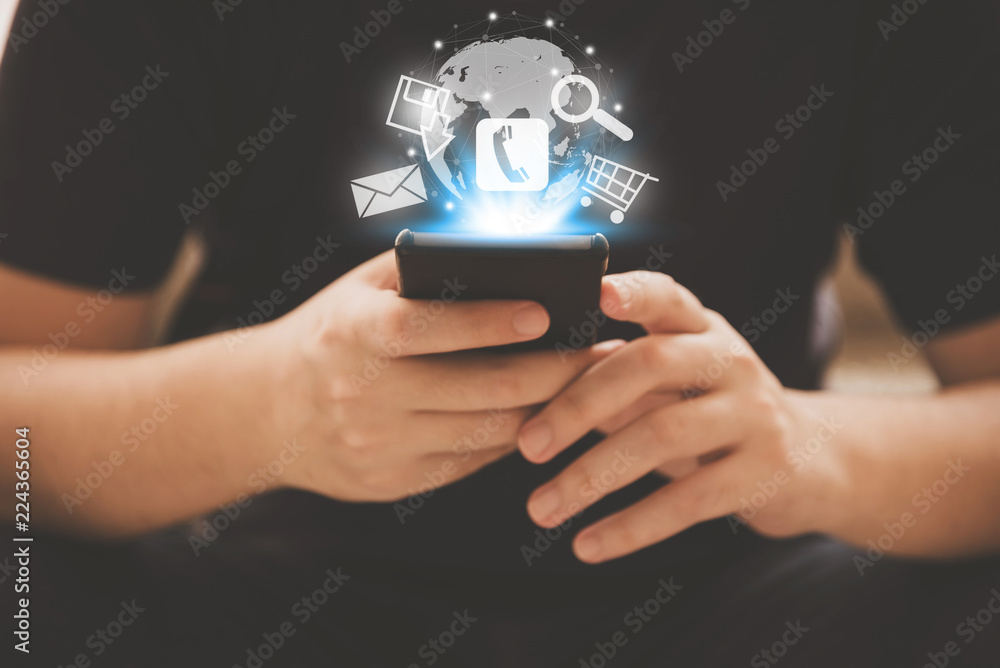 hand of a man is holding smartphone with a symbol icon (mail,phone,pay,shoping online,search,save) hand of a man is holding smartphone with a symbol icon (mail,phone,pay,shoping online,search,save)